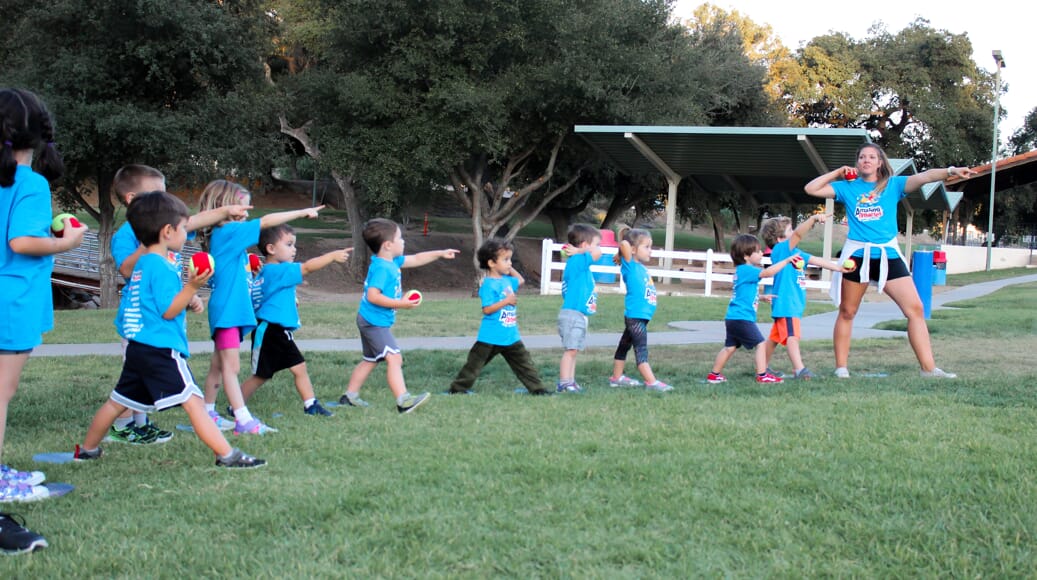 Amazing Athletes Kids Playing on Grass